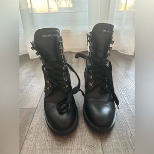 Authentic Prada lace up black leather boots.
